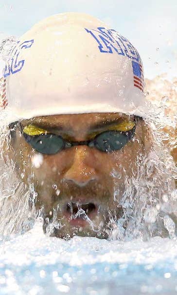 Phelps pulls off grueling morning double, now cutting back